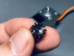 Bottom view of 12T Gear Wheel held within finger tips